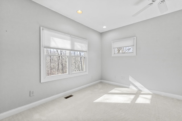 carpeted empty room with ceiling fan