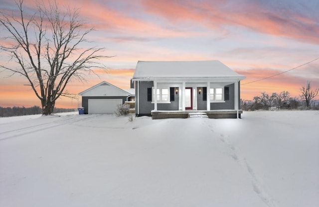 view of front of property with a garage and covered porch