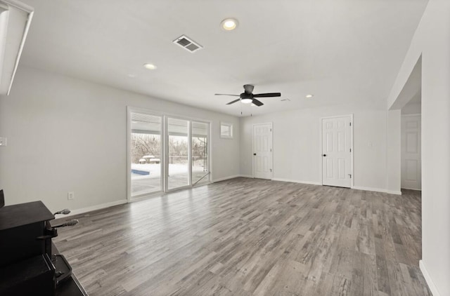 unfurnished living room featuring light hardwood / wood-style floors and ceiling fan