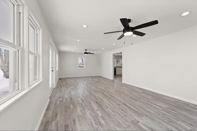 unfurnished living room with light wood-type flooring