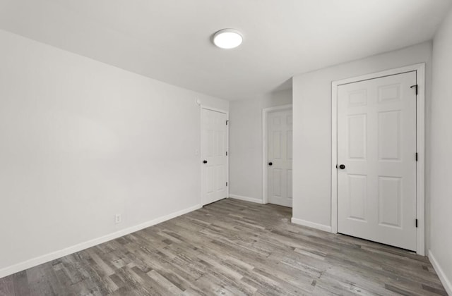 unfurnished bedroom featuring light wood-type flooring