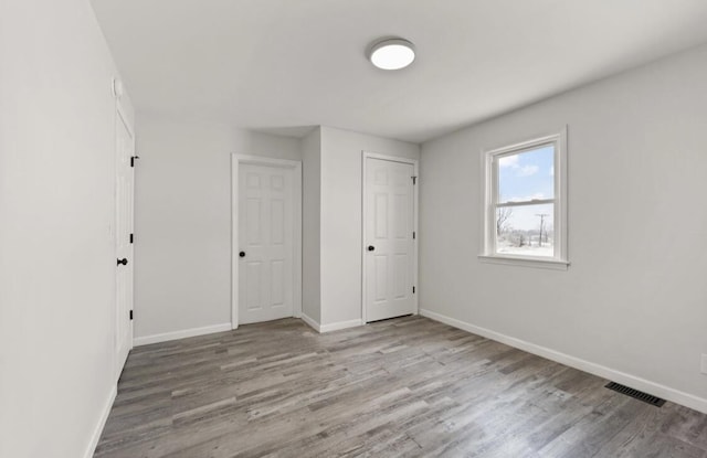 unfurnished bedroom with light hardwood / wood-style floors