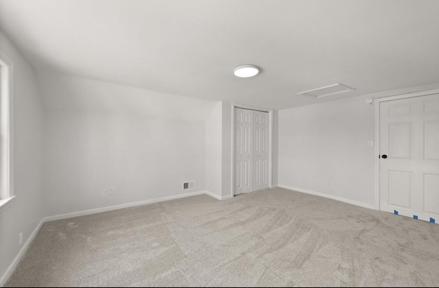 unfurnished room with light carpet