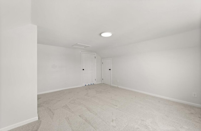 bonus room featuring lofted ceiling and carpet floors