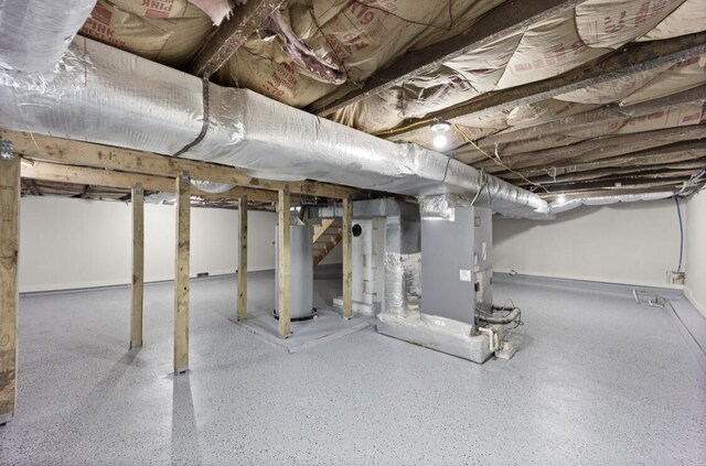 basement with water heater and heating unit