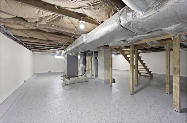 basement with heating unit and water heater