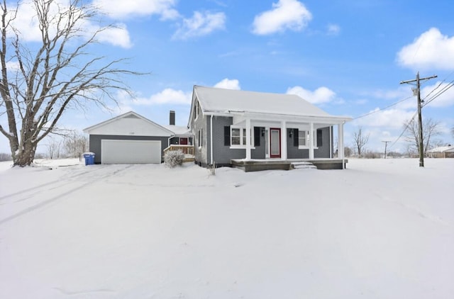 view of front of property featuring a garage and covered porch