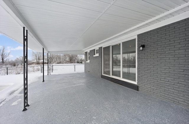 view of snow covered patio