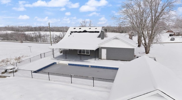 view of snow covered property