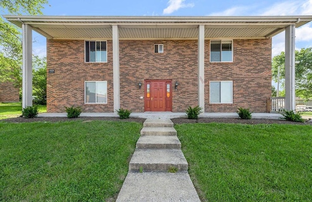 front facade with a front yard