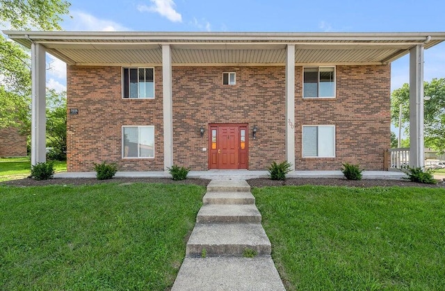 view of property featuring a front yard and a porch