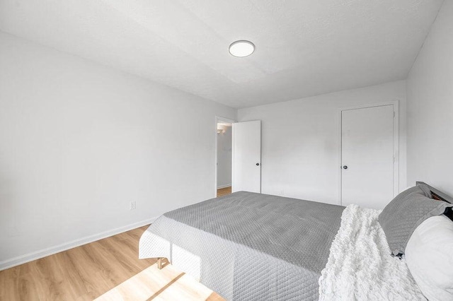 bedroom with hardwood / wood-style floors