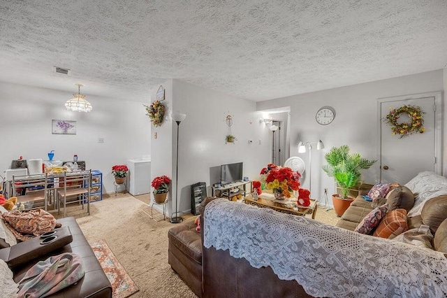 carpeted living room with a textured ceiling