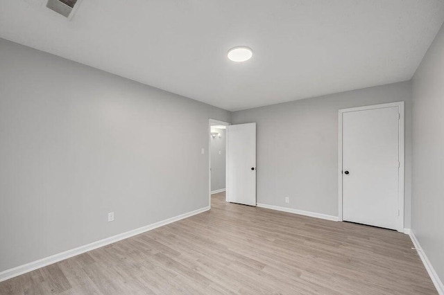 unfurnished room featuring light wood-type flooring