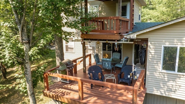 wooden terrace with area for grilling