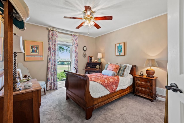 bedroom featuring ceiling fan, light colored carpet, and ornamental molding