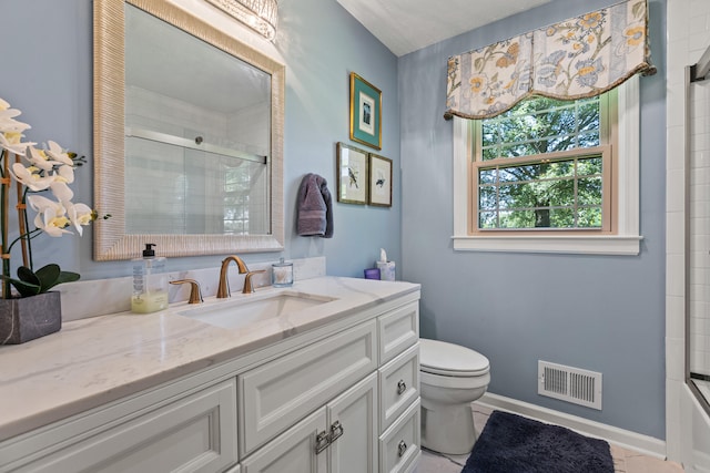 bathroom featuring tile patterned floors, vanity, and toilet