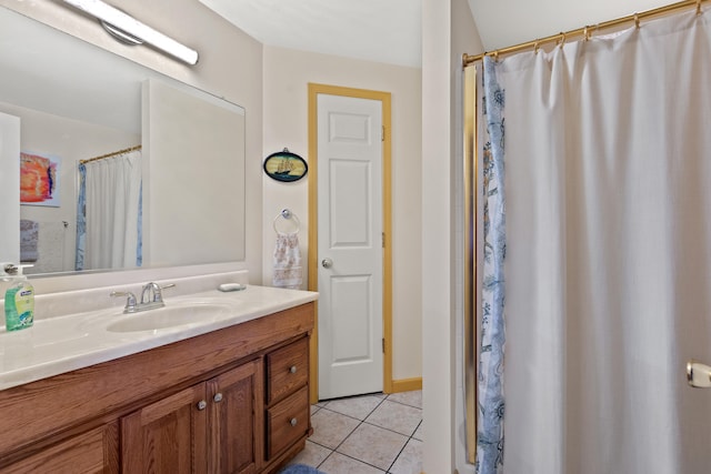 bathroom with tile patterned flooring and vanity