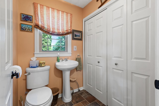 bathroom featuring toilet