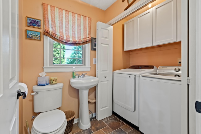 clothes washing area with washing machine and clothes dryer