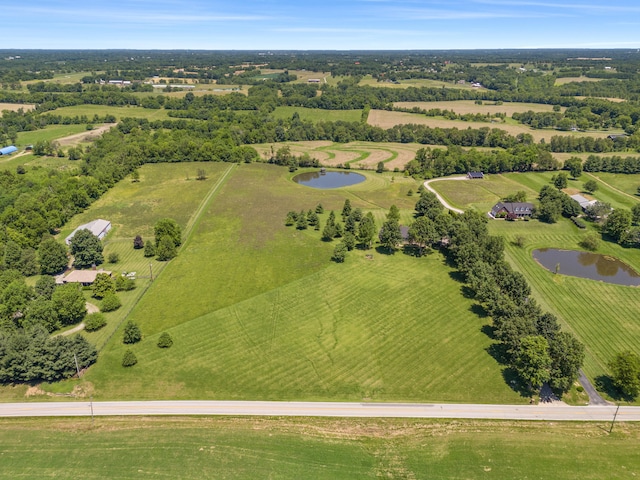 aerial view featuring a rural view and a water view