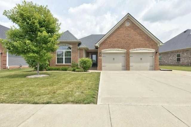 view of front facade featuring a garage and a front lawn