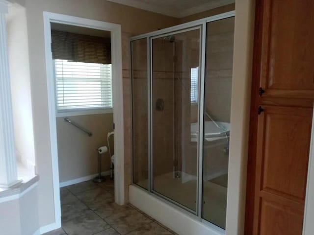 bathroom with tile patterned flooring and a shower with shower door