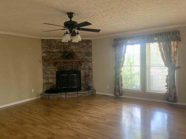 unfurnished living room featuring ceiling fan, crown molding, hardwood / wood-style floors, and a textured ceiling