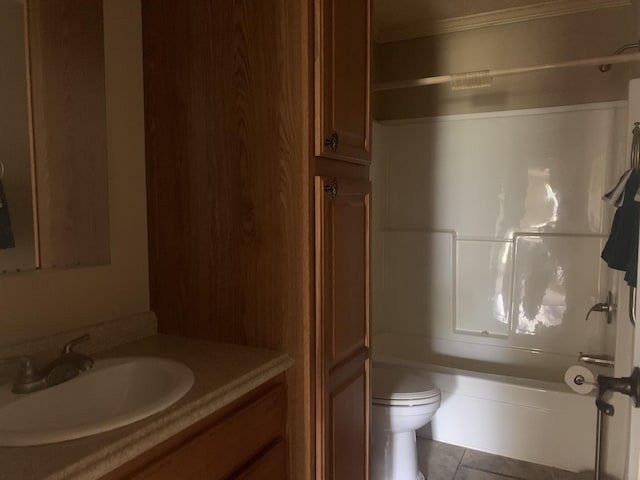 full bathroom featuring tile patterned floors, vanity, bathtub / shower combination, and toilet