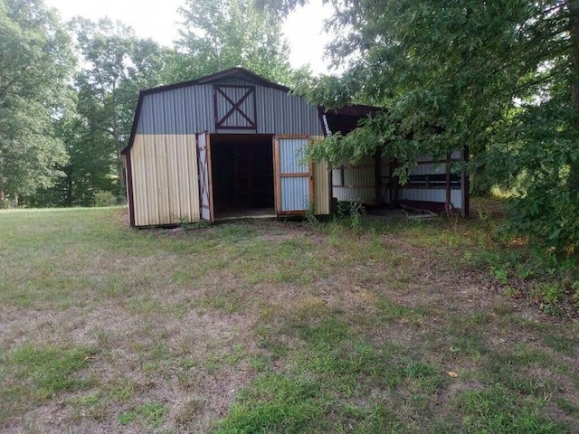 view of outdoor structure with a lawn