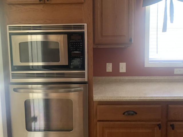 kitchen with oven and built in microwave