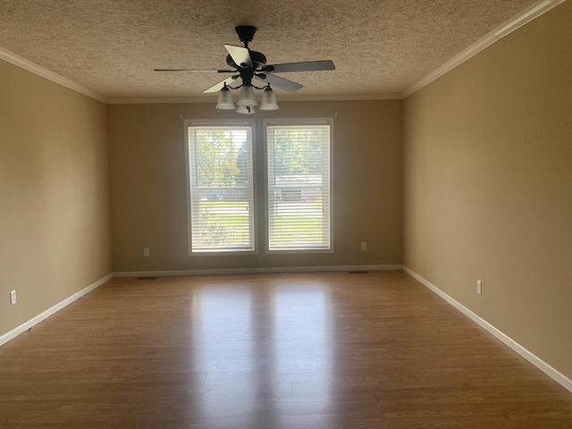 unfurnished room with hardwood / wood-style flooring, ceiling fan, ornamental molding, and a textured ceiling