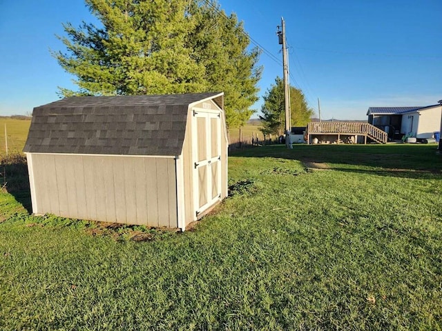 view of outbuilding with a lawn