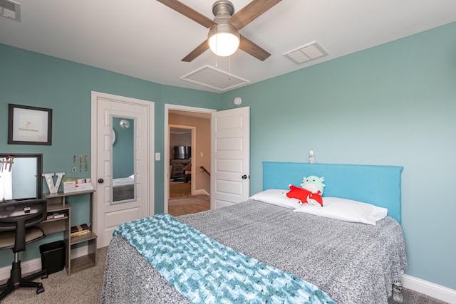 carpeted bedroom featuring ceiling fan