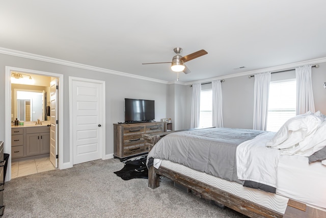 bedroom featuring sink, ensuite bath, ceiling fan, ornamental molding, and light colored carpet