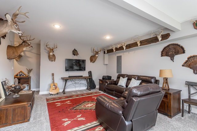 carpeted living room with beamed ceiling and electric panel