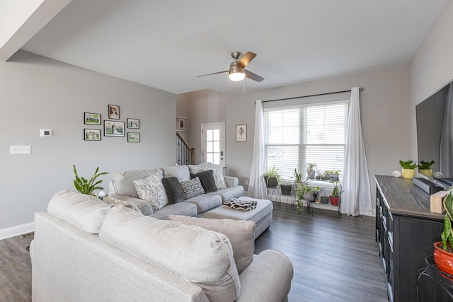 living room featuring dark hardwood / wood-style floors and ceiling fan