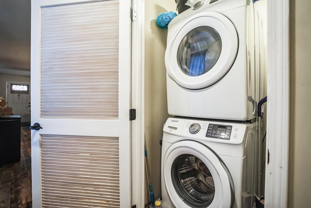 clothes washing area featuring stacked washer / drying machine