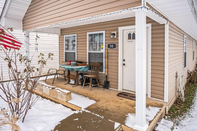 view of snow covered property entrance