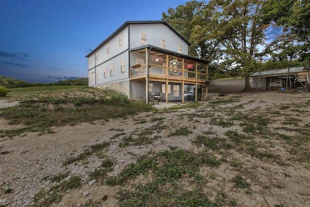 view of back house at dusk