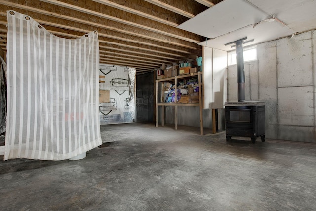 basement featuring a wood stove