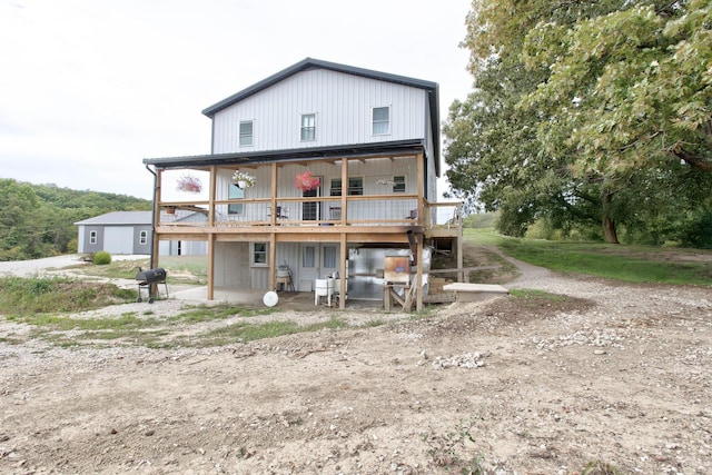 back of property featuring a deck