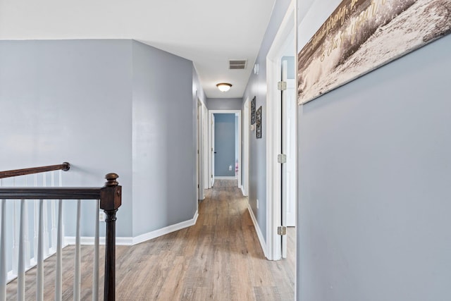 corridor featuring hardwood / wood-style floors