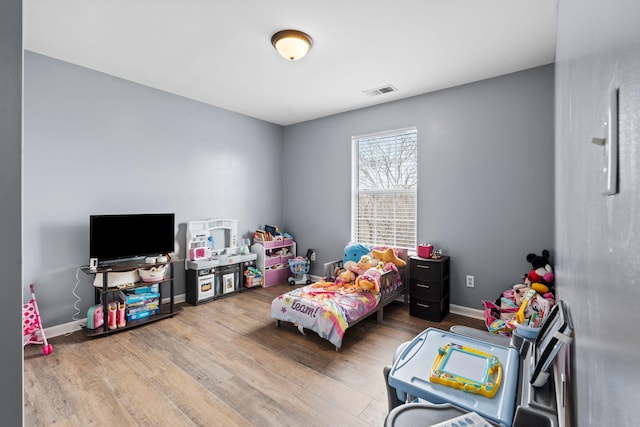 bedroom featuring light wood-type flooring