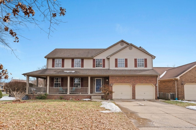 view of front facade featuring a garage, covered porch, and a front lawn