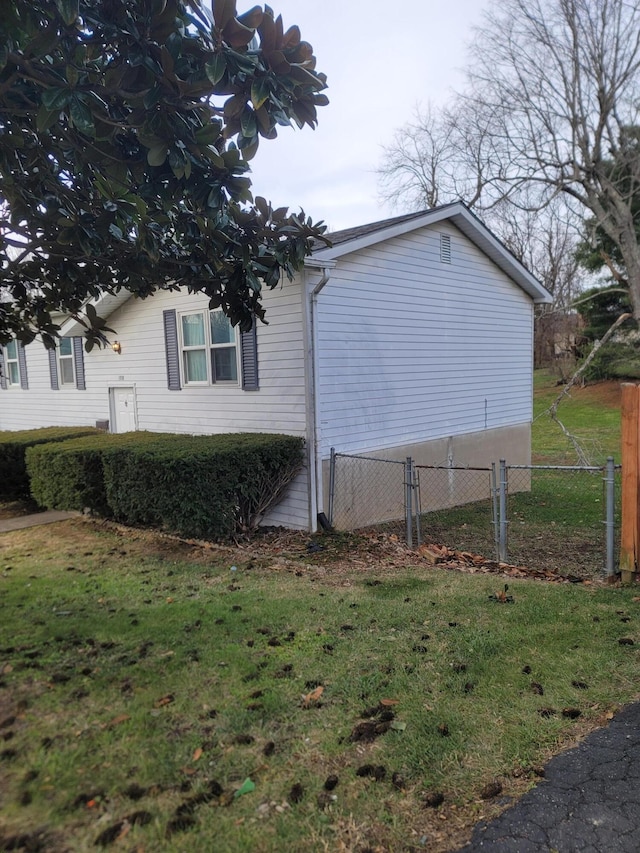 view of home's exterior featuring a yard