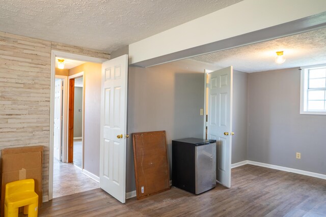 interior space featuring built in shelves and dark hardwood / wood-style floors