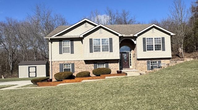 split foyer home with a storage shed and a front yard