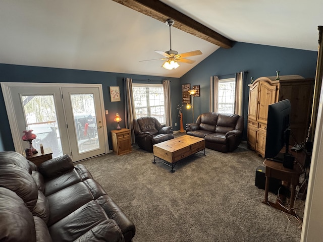 living area featuring vaulted ceiling with beams, ceiling fan, and carpet flooring