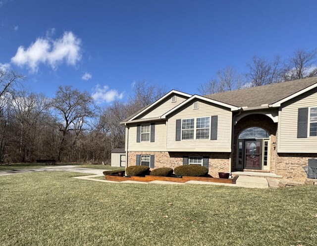 split foyer home featuring a storage shed